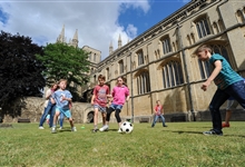 Children playing in Peterborough Cathedral Cloisters